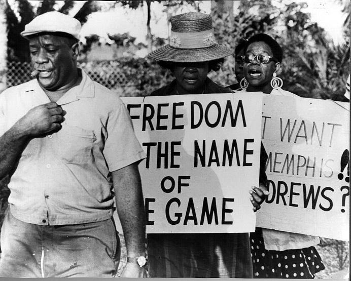historic photo of three people at a civil rights protest