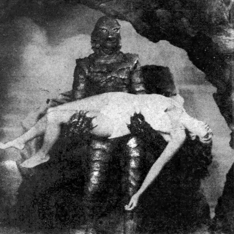 The Gill-Man creature carrying an unconscious woman in a scene from Creature from the Black Lagoon