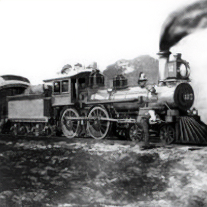 Historic black-and-white photograph of a steam locomotive with crew members visible on and around the engine