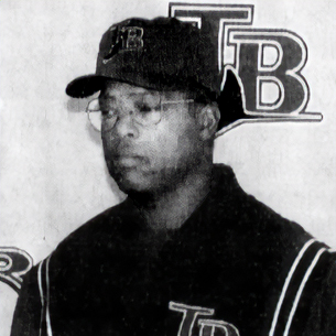 Hal McRae wearing a Tampa Bay Rays baseball cap and jersey in a black and white photo