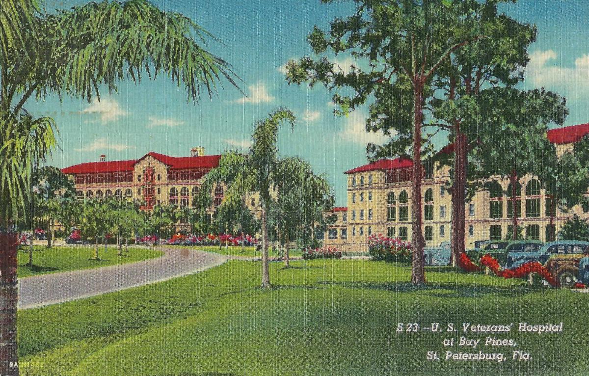 Vintage postcard of the U.S. Veterans' Hospital at Bay Pines, St. Petersburg, Florida, showing red-roofed buildings amid palm trees and manicured grounds