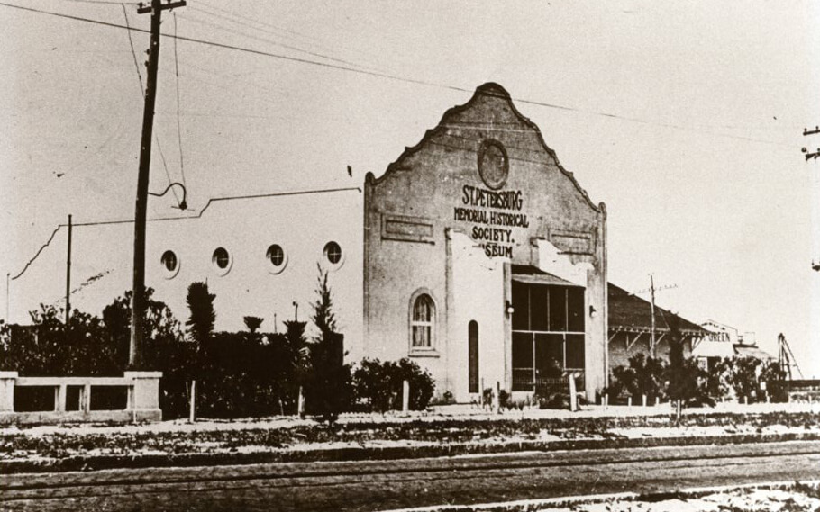 Historic black-and-white photo of the St. Petersburg Memorial Historical Society Museum building with a decorative Mission-style facade