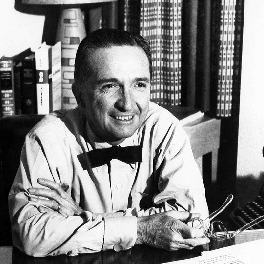 Poynter Nelson at a desk