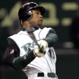 Ray's player, Carl Crawford, holds a baseball bat in mid-swing anticipating the ball