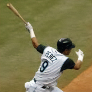 View of Tomás Pérez from behind running with a baseball bat in his hand