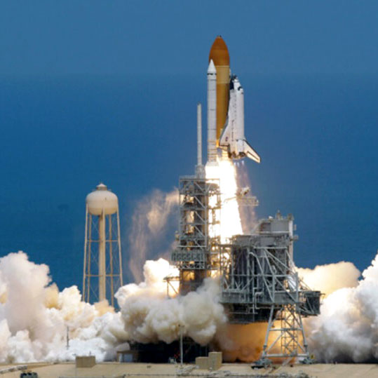 Space Shuttle Atlantis taking off from the launch pad in Cape Canaveral in 2011