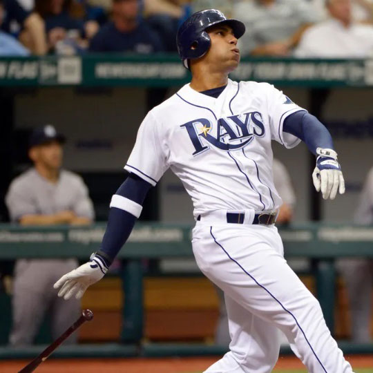 Rays' Carlos Pena drops a baseball bat and appears to be starting this run to first base