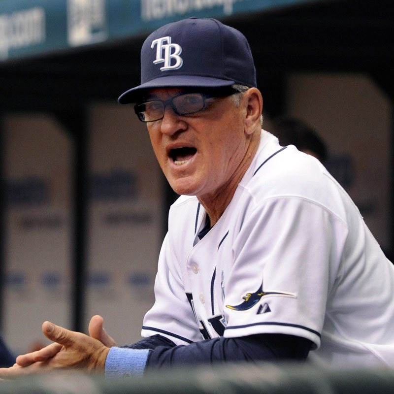Joe Madden wearing a baseball uniform and Tampa Bay Rays hat