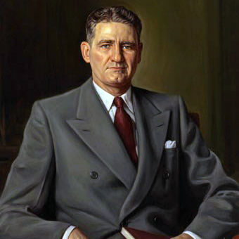 Painting of Millard Fillmore Caldwell wearing a dark suit holding a book in his left hand