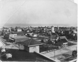Elevated view, looking southwest from the roof of the La Plaza Theater in 1914. In the foreground is the corner of 1st Ave. S. and 5th St. Sibley's (Tomlinson's) tower at 2nd Ave S and 4th St, and St. Mary's Catholic Church is seen at right. Elevated view, looking southwest from the roof of the La Plaza Theater in 1914. In the foreground is the corner of 1st Ave. S. and 5th St. Sibley's (Tomlinson's) tower at 2nd Ave S and 4th St, and St. Mary's Catholic Church is seen at right.