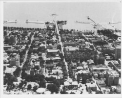 Aerial view looking east along 2nd Ave. N., with the Million Dollar Pier in the background. St. Petersburg Junior College can be seen at 2nd Ave. N. and 5th St. in the foreground, center. The Grammar school and the Suwanee Hotel are lower-right. c. 1940 Aerial view looking east along 2nd Ave. N., with the Million Dollar Pier in the background. St. Petersburg Junior College can be seen at 2nd Ave. N. and 5th St. in the foreground, center. The Grammar school and the Suwanee Hotel are lower-right. c. 1940
