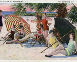 Sun-Bathing in St. Petersburg, Fla. The Sunshine City" Girls under striped umbrellas and palm trees on Spa Beach