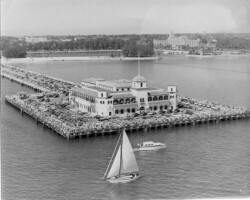 Million Dollar Pier, with a sailboat in front, and the Vinoy Hotel in the background. c. 1950
