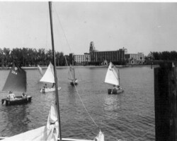 Vinoy Hotel seen across basin from pier with sailing prams foreground. c. 1960