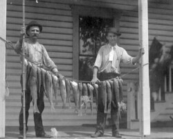 G.A. Churchill and Alec McRae at Pass-a-Grille with big fish catch. c. 1915.
