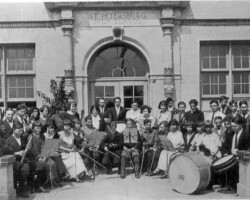 School orchestra posing outside St. Petersburg High School. c. 1918