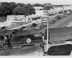 ACL steam locomotive #422 crossing Central. Looking east at the 1300 Block of Central. c. 1948.