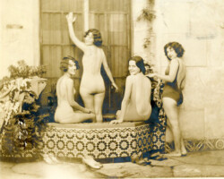 Four bathing beauties in a fountain in the Alhambra Arcade, c. 1930.