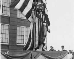 Miss Liberty in Fair and Tourist Week, probably 1913. In front of High School built in 1911.