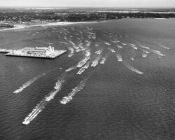Powerboats passing the Million Dollar Pier. c. 1955