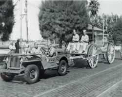 Members of the US Army transport an artillery piece down 2nd Ave NE. In the background is Comfort Station No. 1, which still marks the entrance to the St. Pete Pier. c. 1942