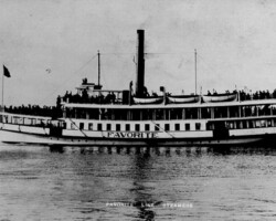 Popular sight-seeing steamer, FAVORITE. c. 1907 Historic black-and-white photo of the steamboat Favorite, a double-deck passenger vessel of the Favorite Line Steamers, crowded with passengers on open decks
