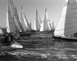 Black and white photo of a large sailboat race with numerous vessels, including sail number 32200, competing on open water