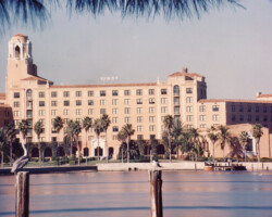 Vinoy Hotel from Vinoy Basin with a pelican in foreground. "Vinoy" sign over top of building. Vinoy Hotel from Vinoy Basin with a pelican in foreground. "Vinoy" sign over top of building.