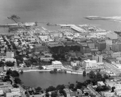 Aeriel view of Mirror Lake, looking east. The newly built Sebring Building and St. Petersburg Judicial Building are along its eastern edge, c. 1973. Aeriel view of Mirror Lake, looking east. The newly built Sebring Building and St. Petersburg Judicial Building are along its eastern edge, c. 1973.